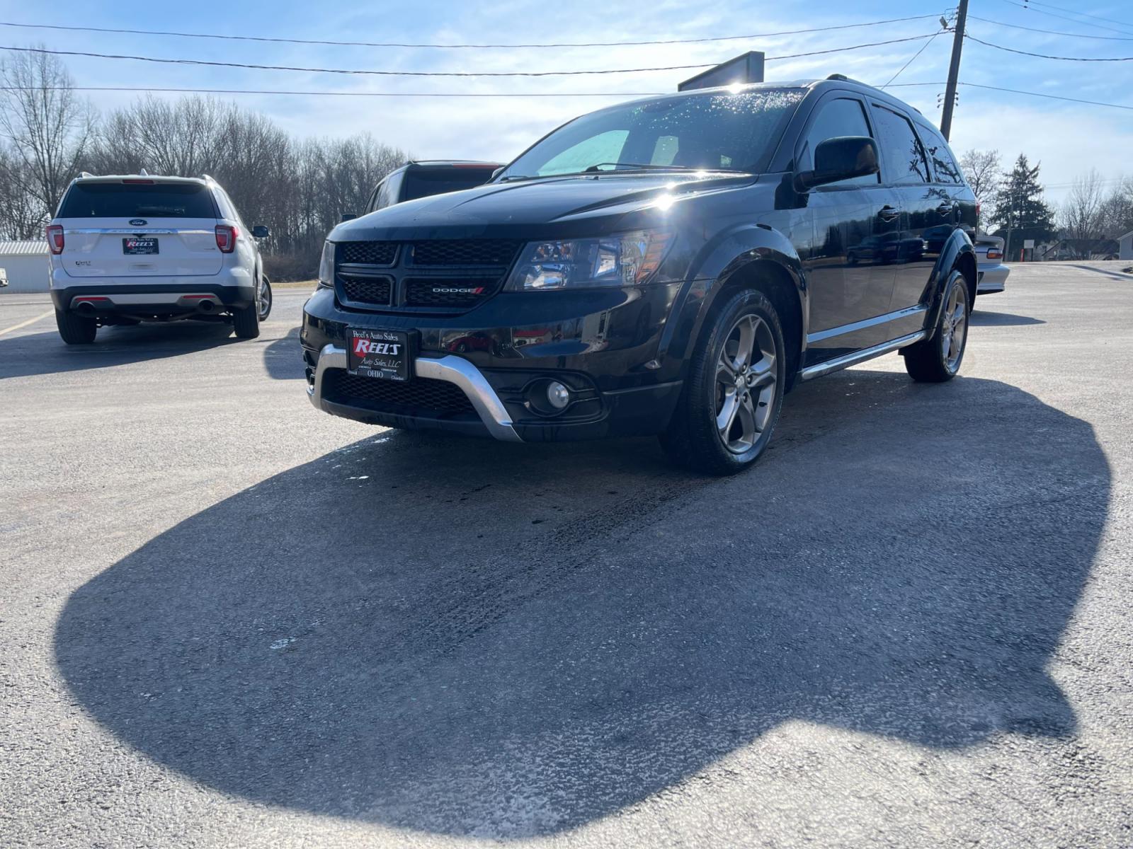 2016 Black /Black Dodge Journey Crossroad Plus AWD (3C4PDDGG9GT) with an 3.6L V6 DOHC 24V engine, 6A transmission, located at 547 E. Main St., Orwell, OH, 44076, (440) 437-5893, 41.535435, -80.847855 - This 2016 Dodge Journey Crossroad Plus AWD, powered by a robust 3.6L Pentastar V6 engine paired with a 6-speed automatic transmission, offers a mix of performance, comfort, and technological convenience. With features like the 8.4" Uconnect system, dusk-sensing headlights, a backup camera with senso - Photo #0